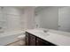 Bright bathroom featuring a vanity with a white countertop and a shower-tub combo at 4311 Portsbrook Ave, Snellville, GA 30039
