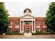 Exterior of the City of Snellville building featuring a clock tower and landscaped grounds at 4311 Portsbrook Ave, Snellville, GA 30039