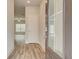 Welcoming entryway showcasing stylish wood-look flooring and a modern door with smart lock at 4311 Portsbrook Ave, Snellville, GA 30039