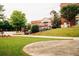The City of Snellville building exterior on well-manicured grounds featuring a circular walking path at 4311 Portsbrook Ave, Snellville, GA 30039