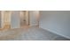 Upstairs hallway featuring neutral walls, carpet flooring, and access to the bathroom at 4311 Portsbrook Ave, Snellville, GA 30039