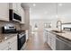 Modern kitchen featuring granite countertops, stainless steel appliances, and ample storage at 4311 Portsbrook Ave, Snellville, GA 30039