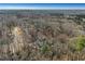 Aerial view showing home's location in a wooded area at 4571 Deep Creek Dr, Sugar Hill, GA 30518