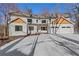 Two-story house with white siding, wood accents, and a three-car garage at 4571 Deep Creek Dr, Sugar Hill, GA 30518