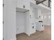 Modern white kitchen with white shaker cabinets and quartz countertops at 4571 Deep Creek Dr, Sugar Hill, GA 30518