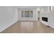 Light-filled living room with hardwood floors and a window at 4571 Deep Creek Dr, Sugar Hill, GA 30518