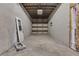 Unfinished storage area with concrete floor and shelving at 4571 Deep Creek Dr, Sugar Hill, GA 30518