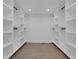 Large walk-in closet with ample shelving and hanging space at 4571 Deep Creek Dr, Sugar Hill, GA 30518