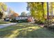 Charming ranch home with a manicured lawn and mature trees at 1260 Amanda Cir, Decatur, GA 30033