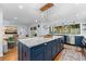 Island kitchen with marble countertop, stainless steel appliances, and hardwood floors at 1260 Amanda Cir, Decatur, GA 30033