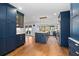 Spacious kitchen with marble countertops, stainless steel appliances, and blue cabinetry at 1260 Amanda Cir, Decatur, GA 30033