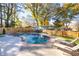 Inviting kidney-shaped pool with brick coping and lounge chairs at 1260 Amanda Cir, Decatur, GA 30033