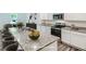 Staged kitchen featuring granite countertops, stainless steel appliances, and white cabinetry at 213 Cottontail Ln, Villa Rica, GA 30180