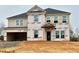 Two-story house under construction, showing the framing at 3136 Morris Hills Dr, Dacula, GA 30019