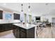 Open concept kitchen with island, white quartz countertops, and stainless steel appliances at 3136 Morris Hills Dr, Dacula, GA 30019