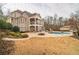 Large backyard with a pool and patio area at 5473 Olde Plantation Dr, Douglasville, GA 30135