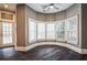 Sun-drenched sitting room with bay windows and hardwood floors at 5473 Olde Plantation Dr, Douglasville, GA 30135