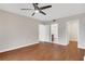 Bedroom with ceiling fan, wood floors, closet, and bathroom at 1280 W Peachtree Nw St # 3009, Atlanta, GA 30309