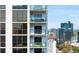 Condo exterior featuring balconies with views of the city skyline on a sunny day at 1280 W Peachtree Nw St # 3009, Atlanta, GA 30309