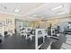 Bright fitness center with black rubber floors and several workout machines at 1280 W Peachtree Nw St # 3009, Atlanta, GA 30309