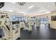 Bright fitness center with several workout machines, black rubber floors and floor to ceiling windows at 1280 W Peachtree Nw St # 3009, Atlanta, GA 30309