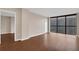 Expansive living room featuring hardwood floors, bright walls, and large windows with city views at 1280 W Peachtree Nw St # 3009, Atlanta, GA 30309