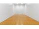 Indoor racquetball court with wood floors, red lines, and bright white walls at 1280 W Peachtree Nw St # 3009, Atlanta, GA 30309