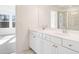 Bright bathroom with double sink and glass shower at 242 Lytham Se Dr, Mableton, GA 30126