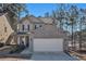 Two-story house with brick and siding exterior, attached garage, and landscaping at 6292 Hickory Lane Cir, Union City, GA 30291