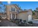 Two-story house with a brick and siding exterior, attached garage, and landscaping at 6292 Hickory Lane Cir, Union City, GA 30291