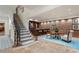 Basement area featuring a bar, seating area, and decorative brick wall providing a stylish and inviting space at 4345 Mount Paran Nw Pkwy, Atlanta, GA 30327