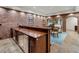 Basement wet bar with wooden countertop and stainless steel appliances at 4345 Mount Paran Nw Pkwy, Atlanta, GA 30327