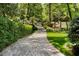 Charming brick driveway leading to a lush, green property at 4345 Mount Paran Nw Pkwy, Atlanta, GA 30327
