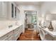 Hallway with marble countertops, hardwood floors and view into the living room at 4345 Mount Paran Nw Pkwy, Atlanta, GA 30327