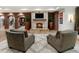 Relax in this cozy living room with a brick accent wall and a beautiful stone fireplace at 4345 Mount Paran Nw Pkwy, Atlanta, GA 30327