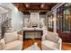 Comfortable living room with wood floors, coffered ceilings, fireplace, and large windows at 4345 Mount Paran Nw Pkwy, Atlanta, GA 30327