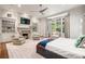 Large main bedroom with fireplace, built-in shelving, sitting area, and large windows at 4345 Mount Paran Nw Pkwy, Atlanta, GA 30327