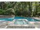 Sparkling pool and jacuzzi surrounded by lush landscaping and serene wooded views at 4345 Mount Paran Nw Pkwy, Atlanta, GA 30327