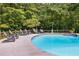 Inviting kidney shaped pool with surrounding lounge chairs at 5917 N Helton Rd, Villa Rica, GA 30180