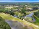 Community overview: golf course, lake, and luxury homes at 4851 Hanalei Holw, Suwanee, GA 30024