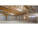 Unfinished basement with exposed beams and plumbing stubbed at 4851 Hanalei Holw, Suwanee, GA 30024