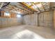 Unfinished basement with exposed beams and windows at 4851 Hanalei Holw, Suwanee, GA 30024