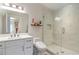 Modern bathroom with white cabinets and a glass shower at 4851 Hanalei Holw, Suwanee, GA 30024