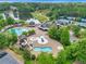 Community pool area with water slide, multiple pools, and clubhouse at 4851 Hanalei Holw, Suwanee, GA 30024