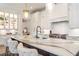 Spacious kitchen with island, white cabinetry, and quartz countertops at 4851 Hanalei Holw, Suwanee, GA 30024