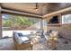 Relaxing sunroom with wicker furniture and view of the backyard at 4851 Hanalei Holw, Suwanee, GA 30024