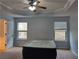 Spacious bedroom with ceiling fan and two windows at 5462 Union Hill Ct, Union City, GA 30291