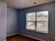 Bright bedroom with neutral walls and carpet at 5462 Union Hill Ct, Union City, GA 30291