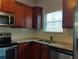 Well-equipped kitchen featuring granite countertops and wood cabinets at 5462 Union Hill Ct, Union City, GA 30291