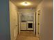 Convenient laundry room with washer, dryer, and shelving at 5462 Union Hill Ct, Union City, GA 30291